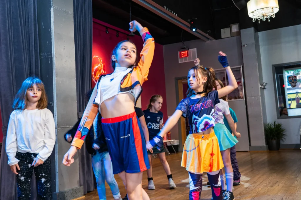 Kids dancing K-pop choreography in a Salsa With Silvia studio class
