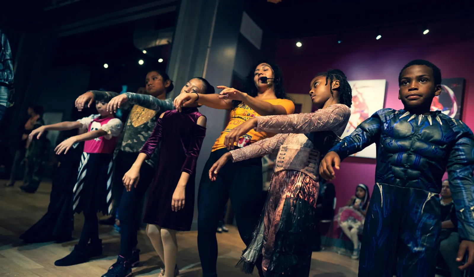 Kids in Halloween costumes doing a zombie dance at Salsa With Silvia DC