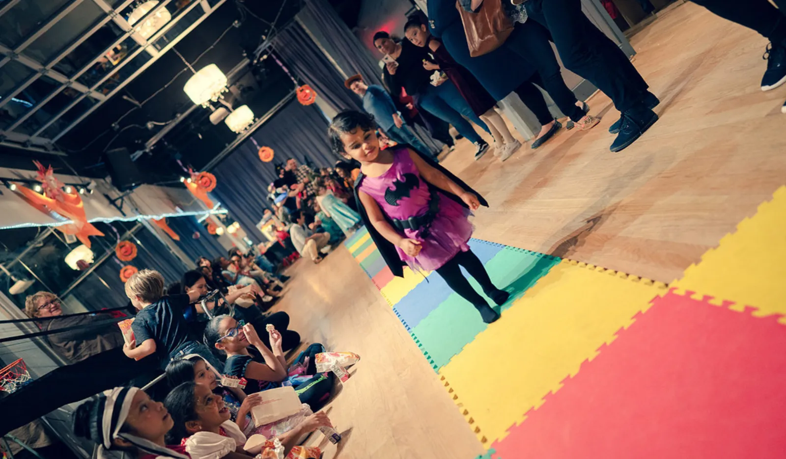 Girl in costume walking the runway at a kids Halloween costume parade in Washington DC